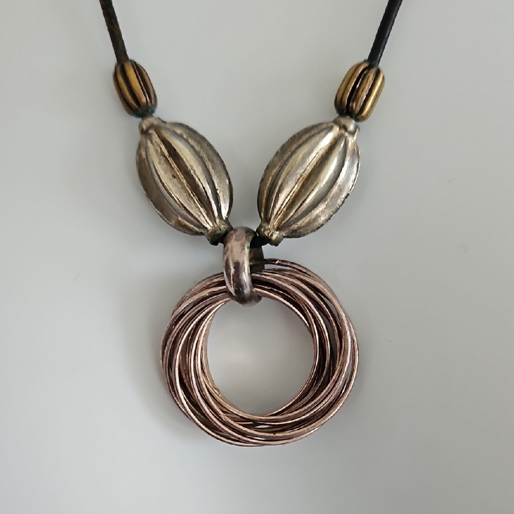 Swirl Circles Pendant Necklace With Accent Beads On Leather Cord